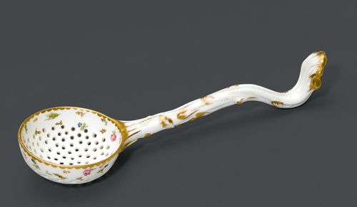 SUGAR SPRINKLER SPOON,probably Nyon, ca. 1781-1813. Handle designed as a branch. Perforated ladle, painted with flowers, accentuated in gold. L 19 cm. Provenance: Private collection, Geneva.