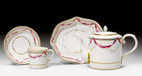 PIECES OF A TEA SERVICE WITH A PURPLE BAND,Nyon, 1781-1813. Each piece with a purple ribbon, green leaf garland and grisaille braided band between gold borders. Comprising: 1 tea pot, 1 saucer and 1 'litron' cup with saucer. Underglaze blue fish marks. Cover of the tea pot, missing. H tea pot 11 cm. (4) Provenance: Private collection, Geneva.