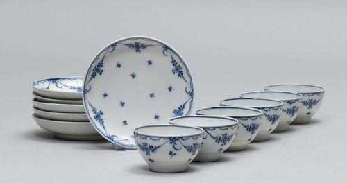 LOT OF 6 CUPS WITH SAUCERS AND BLUE DECORATION,Nyon, ca. 1781-1813. Each piece with floral festoons and flowers in underglaze blue. Underglaze blue fish mark. 1 hairline crack. Provenance: Private collection, Geneva.