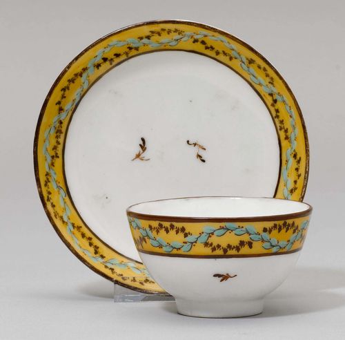 CUP AND SAUCER,Nyon, ca. 1781-1813. Painted with turquoise and brown leaf tendrils on a light brown ground. Unmarked. Rubbed. Provenance: Private collection, Geneva.