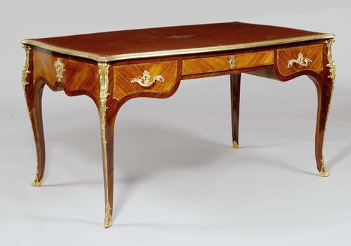 A BUREAUPLAT, Louis XV style, France, 19th century. Rose- and tulipwood, red leather top. Bronze mounts. 143x88x77 cm.