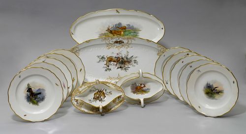 PARTS OF A HUNTING SERVICE,Meissen, ca. 1900. Painted with hunting medallions. Comprising: 12 dining plates (25 cm) 1 oval platter (55 cm) 1 oval platter with relief decoration (60 cm) 1 sauce boat (26 cm) 1 sauce boat with relief decoration (26 cm). Underglaze blue sword marks. 1 oval platter and sauce boats, matching. (14)