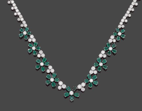 BRILLIANT-CUT DIAMOND AND EMERALD NECKLACE, HARRY WINSTON, Geneva. Platinum. Very attractive, elegant necklace, slightly graduated towards the top, entirely set with 111 brilliant-cut diamonds totalling ca. 17.00 ct and of a fine quality, the nine blossom motifson the top are additionally decorated with 45 drop-shaped Sandawana emeralds totalling ca. 9.00 ct. Fastener mechanism white gold. L ca. 36.5 cm.