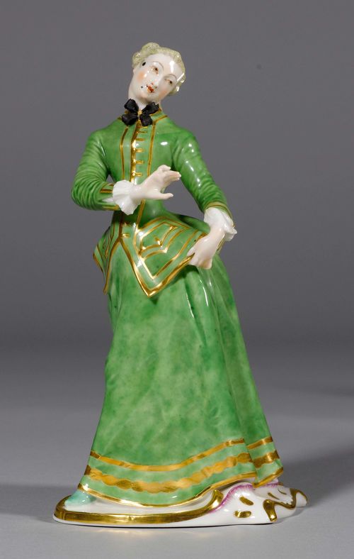 JULIA, Nymphenburg, from the series of the Commedia dell'Arte figures by F.A. Bustelli from 1760, moulding 20th century. In a green hunting outfit, gold edging. Impressed faceted shield on the bottom and on the base, impressed numbers 11/0, H 21.5 cm.