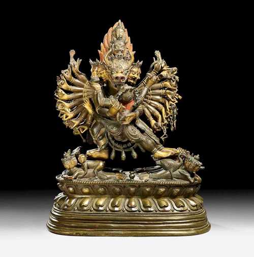 VAJRABHAIRAVA .Sino-Tibetan, 18th century H 25.5 cm. Richly detailed bronze figure with remains of gilding on the heads, hands and feet, also red colour in the hair. Separately cast lotus plinth.