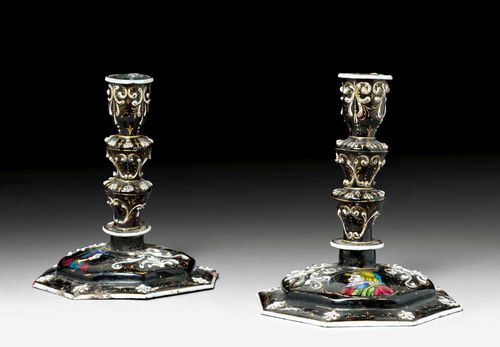 PAIR OF ENAMELLED CANDLE HOLDERS,Renaissance style, probably  Limoges, 19th century Polychrome enamelled copper, with portraits and scrolls on black ground. H 15 cm. Provenance: from an important European collection. matching lot number. 1011.