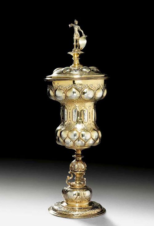 SILVER-GILT CUP AND COVER Nuremberg circa 1600.Maker's mark  Hans Weber. With chased motif of a standing warrior with shield as finial. H 29.5 cm. 430 g. Provenance: Fritz Payer