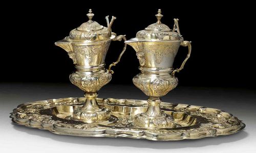 SILVER-GILT VESSELS FOR MASS. Augsburg, mid 18th century.Maker's mark  Johann Georg Jaser. The plate with chased and embossed rocaille, flowers and shaped edge. The jug with domed foot and matching lid. Some repairs. H 17 cm. 852 g.