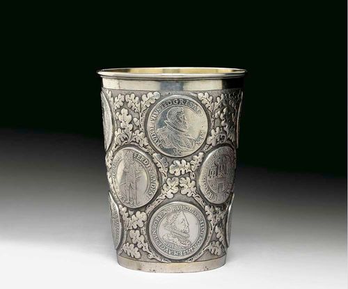 BEAKER WITH COINS. No mark. Probably 17th century.Coins set in an embossed ground. H 14 cm. 570 g.