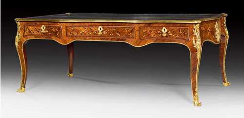 LARGE BUREAU PLAT "A DOUBLE FACE",Louis XV, attributed to J. DUBOIS (Jacques Dubois, maitre 1742), Paris circa 1760. Tulipwood, rosewood, and partly dyed precious woods in veneer with exceptionally fine inlays on all sides. The top lined with gold-stamped brown leather and edged in bronze. Same, but sham arrangement verso. Exceptionally fine, matte and polished gilt bronze mounts and sabots. 200x111x78 cm. Provenance: - Galerie Segoura, Paris. - From a very important European private collection.