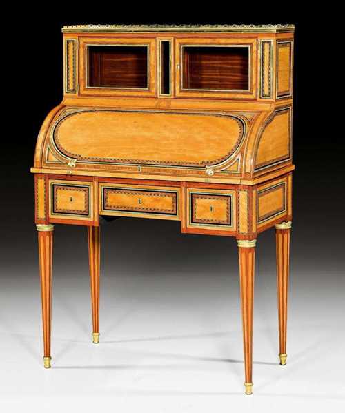 SMALL CYLINDER DESK,Louis XVI, stamped C.C. SAUNIER (Claude Charles Saunier, maitre 1752), Paris circa 1775/80. Amaranth, lemonwood and ebony in veneer and finely inlaid with reserves, fillets and frieze. Pull-out writing surface lined with green, gold-stamped leather and a fitted interior of drawers and compartments. Exceptionally fine, matte and polished gilt bronze mounts and sabots. "Carrara" top edged with a pierced bronze rail. Freestanding. 81x43x(open 65)x123 cm.