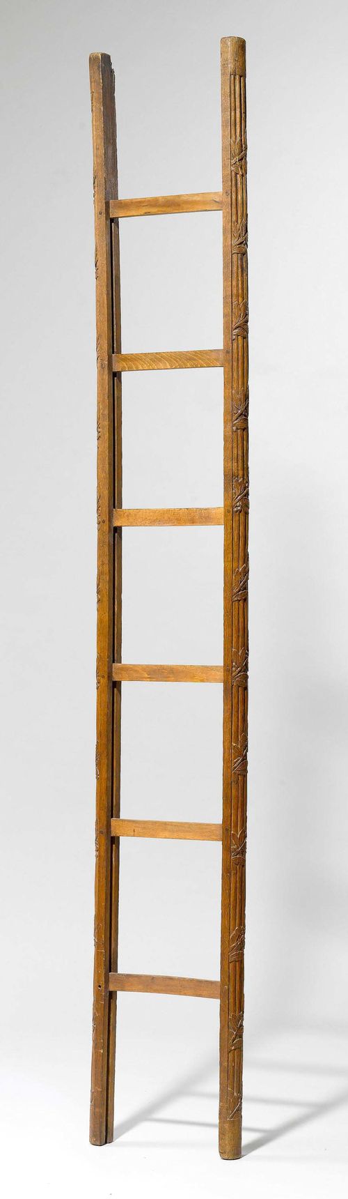 LIBRARY LADDER,Louis XVI, France. Oak, foldable ladder carved leaf garlands. L 232, in the open state L 205 cm.