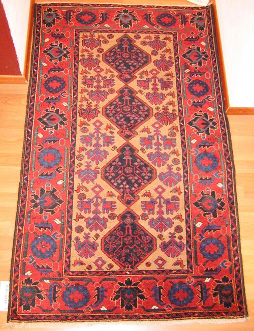 CHORASSAN old.Beige ground with four blue medallions, decorated with stylised plants and animals, red border. slight wear, 165x100 cm.