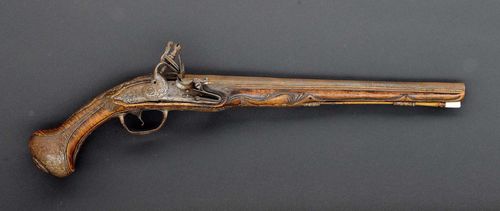 FLINTLOCK PISTOL,German, ca. 1750. Round barrel (L 35.7 cm), Cal. 16 mm. Lock plate and cock, domed and decorated with flowers. Walnut stock, carved. Iron mounts. Wooden ramrod. Total length 54 cm. Requires restoration.