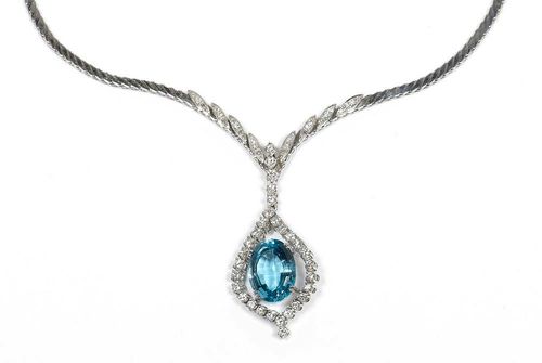 AQUAMARINE DIAMOND NECKLACE, ca. 1950. White gold 750. Elegant necklace, the top decorated with fine leaf motifs, set with 24 brilliant-cut diamonds and single-cut diamonds and with a removable drop-shaped pendant set with 1 oval aquamarine of ca. 9.40 ct, framed by 30 brilliant-cut diamonds. Total weight of the diamonds ca. 3.00 ct. L ca. 47 cm.