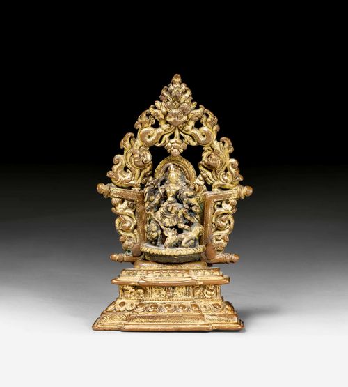 A BEAUTIFUL GILT COPPER THRONE. Nepal, ca. 14th c. Height 12.5 cm. Durga figure added later.