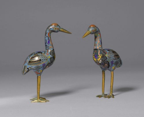A PAIR OF CLOISONNÉ CRANES WITH ARCHAISTIC STYLISED PLUMAGE ON A TURQUOISE GROUND. China, late Qing Dynasty, Heights 18 and 19 cm. Minor chips. (2)