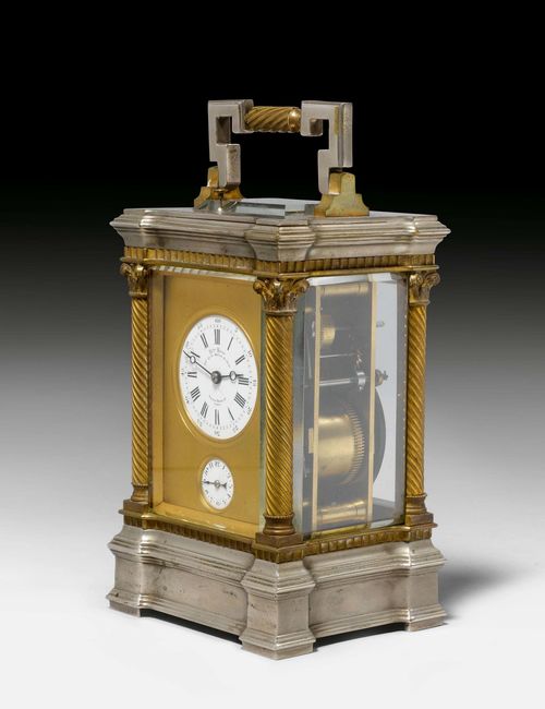 FROM THE DE AMODIO COLLECTION: TRAVEL CLOCK WITH ALARM,France, middle of the 19th century. The dial signed: CH(AR)LES UDIN H(ORLO)GER DE LA MARINE DE L'ETAT PALAIS ROYALE 52, PARIS. Metal, silver-plated and parcel-gilt. Glazed all around. White enamel dial, alarm dial below. Movement with main spring, striking the 1/2-hour on gong. Repetition on demand. Alarm requires servicing. H 19 cm. With leather case. Provenance: - from the collection of the Marquis and the Marquise de Amodio y Moya.