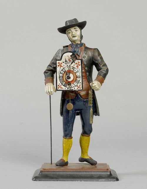 FIGURE CLOCK,Black Forest. Cast iron, painted. Movement with spring winding. H 38 cm.