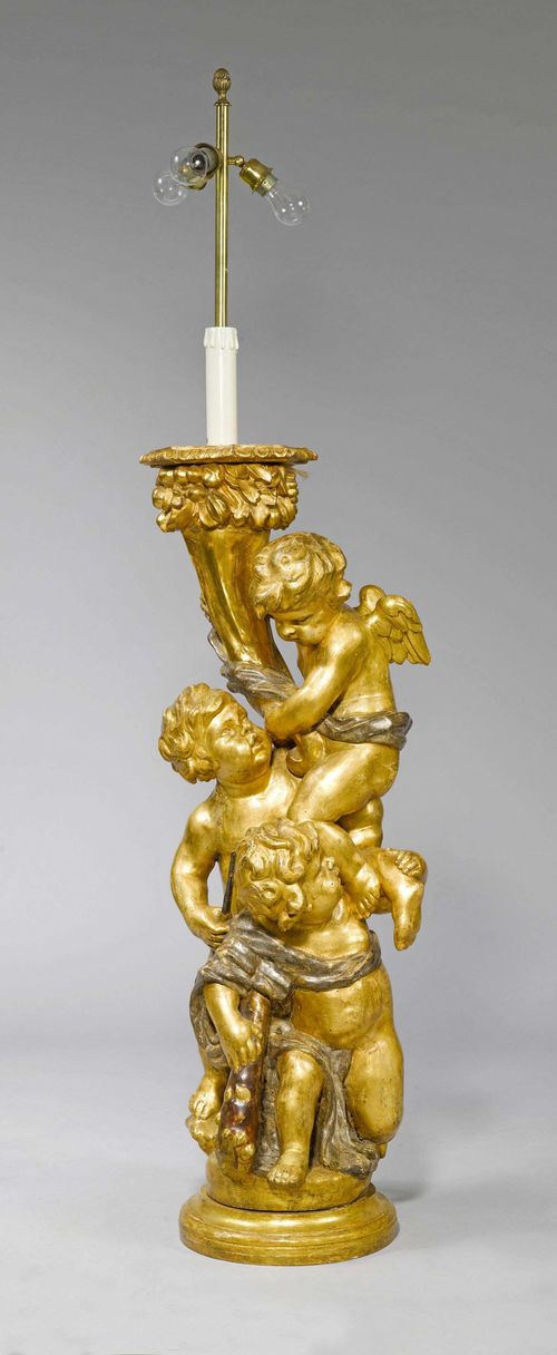 CANDELABRA WITH FIGURES,Baroque style, Italy, 19th century. Wood, carved with 3 angels holding a cornucopia candelabra, gilt and silver-plated. H 123 cm. Some losses.