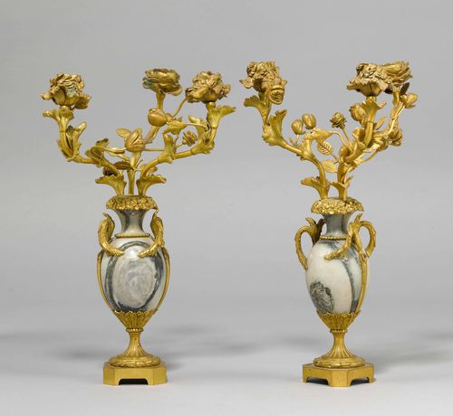 PAIR OF VASE-SHAPED CANDELABRAS,France, Napoleon III. Grey marble, in part veined, and gilt bronze. 3 light branches with rose-shaped nozzles on a retracted, round foot with square plinth. H 37.5 cm.