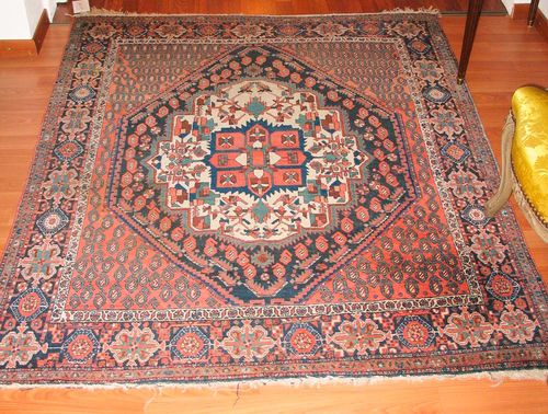 AFSHAR old.White central medallion on a rust coloured ground, the entire carpet is finely patterned with boteh motifs and stylized plants, black border, good condition, 160x130 cm.
