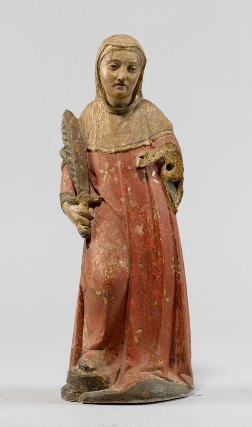 FIGURE OF A FEMALE MARTYR,probably Saint Agnes, after the Gothic style, France, 16th/17th century. Stone sculpture, fully carved in the round and painted.  H 47 cm. The paintwork greatly retouched, with repairs on the plinth area, the head glued. The left arm incomplete.