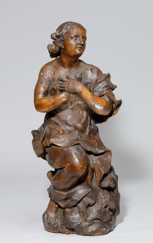 ADORING ANGEL,Baroque, probably German, 18th century. Wood, fully carved in the round and with a dark patina.  H 72 cm. Repairs and losses.