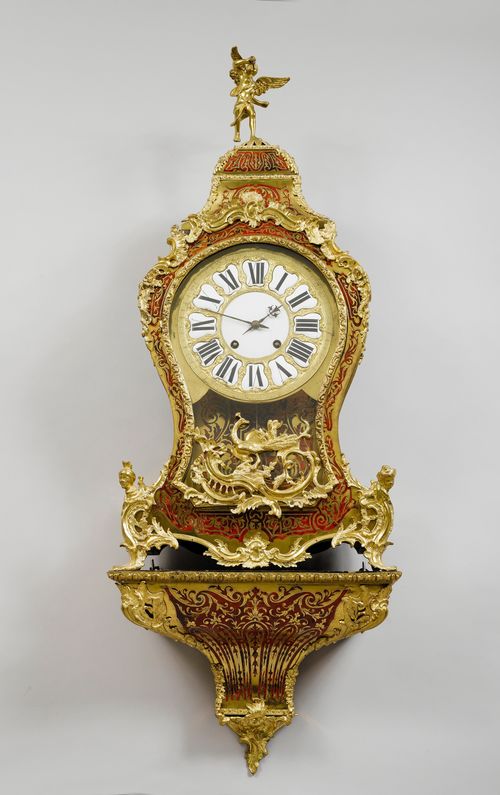 BOULLE CLOCK ON PLINTH,late Regence, France, 18th/19th century. Curved, wooden case, inlaid with red tortoiseshell and brass tendrils. Bronze mounts. Bronze dial with white enamel cartouches. Movement with verge escapement, striking the 1/2-hour on bell. H 135 cm. Minor losses.