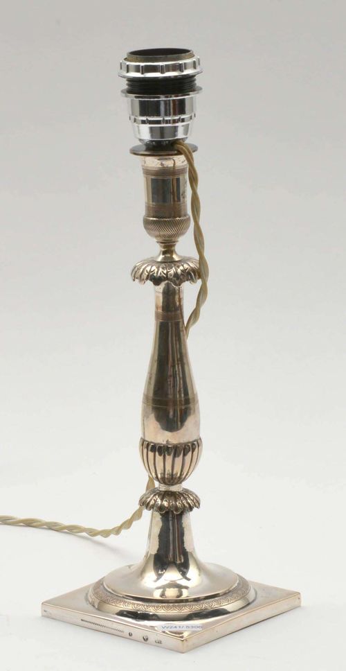 CANDLE STICK,Berlin, 1st half of the 19th century. Maker's mark Wilhelm Borcke. Square base. Fitted for electricity. H 33 cm.