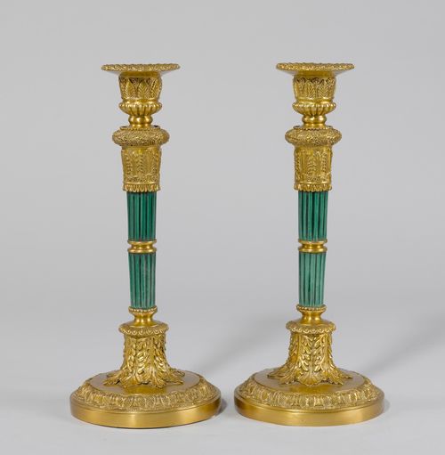 PAIR OF LARGE CANDLESTICKS,in the Empire style. Russia. Bronze. Conical shaft, in part enamelled green. Bronze mounts, decorated with flowers, leaves and palmettes. Vase-shaped nozzle with broad lip. On a round base. H 39.5 cm.
