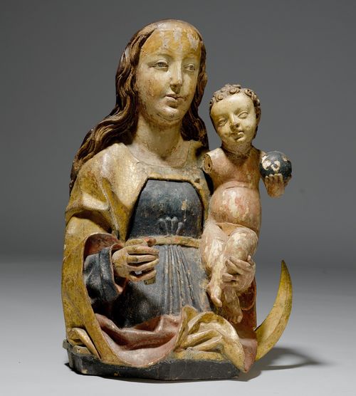 BUST OF MADONNA AND CHILD ON A CRESCENT MOON,late Gothic, Southern Germany, Franconia, ca. 1500. Lime, carved and painted. Mary on an octagonal base with crescent moon, carrying the Infant Jesus in her left arm. H 62 cm. Crown and right arm of the child are missing. Different paintwork. Part of the crescent moon is missing.