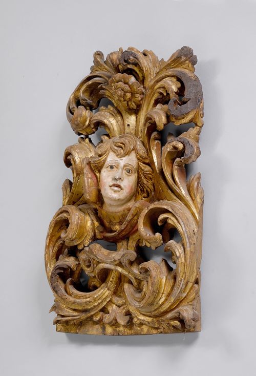 WINGED HEAD OF AN ANGEL IN AN ACANTHUS CARTOUCHE,Baroque, Italy, ca. 1680/1700. Wood, carved and painted. H 65 cm.