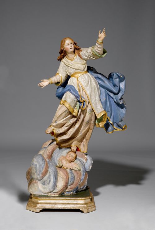 THE ASCENSION OF MARY,Baroque, Southern Italy, probably Naples, end of the 18th century. Wood, carved and painted. With open arms and looking up at the sky, standing on a cloud with a head of an angel. Glass eyes. H 144 cm.