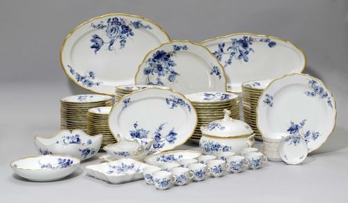 LARGE DINING SERVICE 'BLUE FLOWER',Meissen, 20th century. SALE ROOM NOTICE: The Service contains 12 cups and saucers (not 24 as stated in the catalogue) and 2 square dishes (not 4 as stated in the catalogue) (a total of 134 pieces) Painted with large blue flower bouquets and gold edging. Comprising: 36 plates (25 cm) 18 plates (21.5 cm) 18 plates (16 cm) 18 soup plates (23.5 cm) 12 cups and saucers 2 round platters (39 cm) 2 round platters (31.5cm) 2 deep platters (25 cm) 2 oval platters (49cm) 2 oval platters (35 cm) 2 oval platters (23 cm) 2 rectangular platters (22 cm) 2 sauce boats 2 soup bowls (25 cm). Underglaze blue sword marks.  (134))