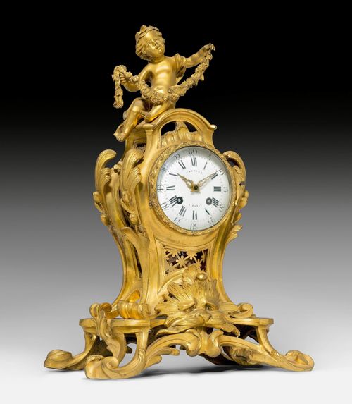 MANTEL CLOCK "A L'AMOUR",Napoleon III in the style of Louis XV, the dial inscribed CRONIER À PARIS. Gilt bronze. Curved case with prominent scrolled feet and with a figure of Cupid on top. Enamel dial with hours in Roman numerals and minutes in Arabic numerals. Parisian movement, striking the 1/2-hour on bell. H 40 cm. Provenance: - from a private collection, Suisse romande.