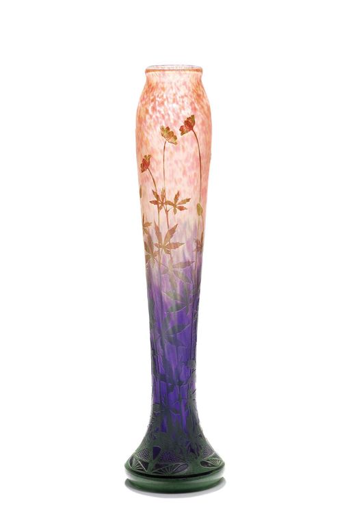DAUM NANCY, VASE, circa 1900. Blue-pink glass overlaid in green and pink, with etched and finely carved decoration. Decorated with applied wildflowers. H 52 cm.