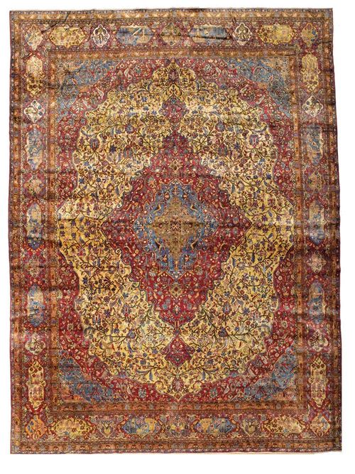 KESHAN SILK antique. Central medallion in violet and blue on yellow ground, with blue and violet corner motifs. Finely decorated throughout with trailing flowers, palmettes and birds. The border in dark red with plants and birds. Restored, otherwise good condition. 420x315 cm.