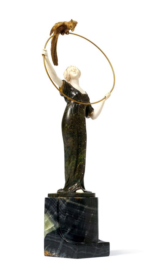 ANONYMOUS WORK, SCULPTURE, circa 1920. Bronze and ivory with painted decoration. Lady with parrot on black marble plinth. H 30 cm.