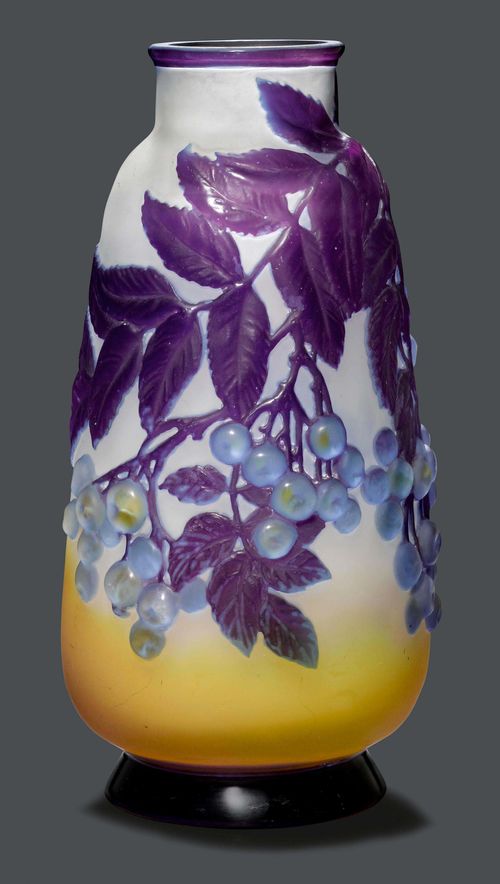 EMILE GALLE VASE SOUFFLE, circa 1920 Yellow glass with blue and violet overlay and etching. Conical vase, decorated with cherries. Signed Gallé. H 29 cm.