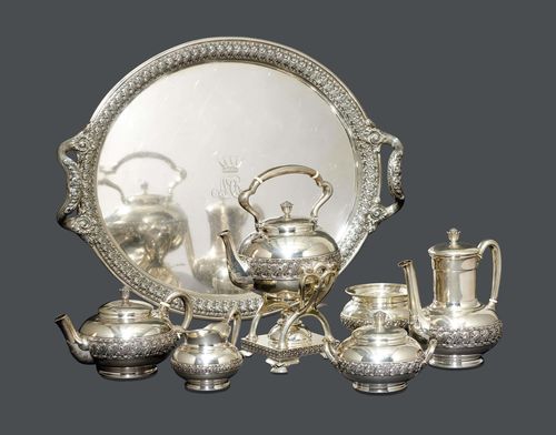 TIFFANY & CO. TEA AND COFFEE SERVICE, circa 1900 Sterling silver 925-1000. Comprising: kettle with rechaud, tea pot, coffee pot, cream jug, sugar bowl, bowl and oval tray. All items are finely decorated with stylized leaves and a crowned monogram. Stamped: Tiffany & Co. Sterling Silver 925-1000. L tray 69 cm. 10300 grams.