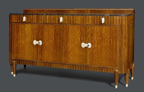 Attributed to CHRISTIAN KRASS LYON (1868-1957) BUFFET, circa 1925 Amaranth and carved ivory. Rectangular with 3 doors and 3 drawers. Inlaid with bone ornaments. Nice mounts of finely carved ivory. Black marble top. H 112 cm. W 197 cm. D 80 cm.