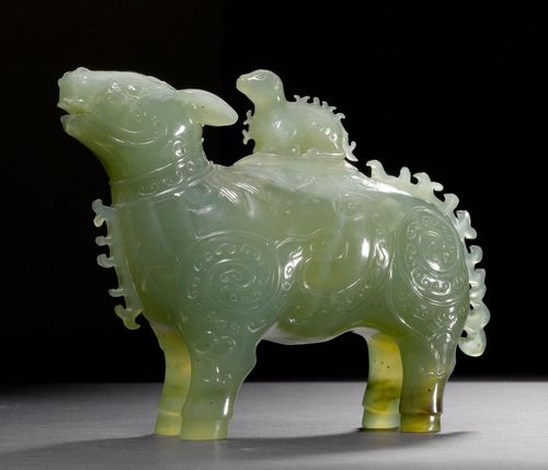A LIDDED JADE VESSEL IN THE FORM OF A MYTHICAL CREATURE. China, 20th c. Height 13.2, Length 16 cm. Celadon-coloured jade with white inclusions. Cover with minor chips.