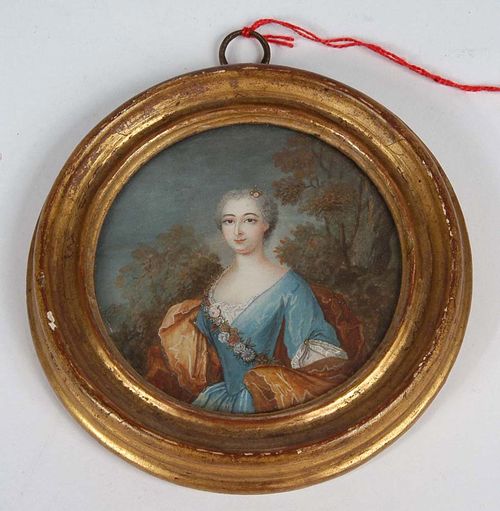 France. 18th century. Painting on vellum. Oval half portrait of young woman of the court of Louis XV, set against landscape background. Ø 7.3 cm.