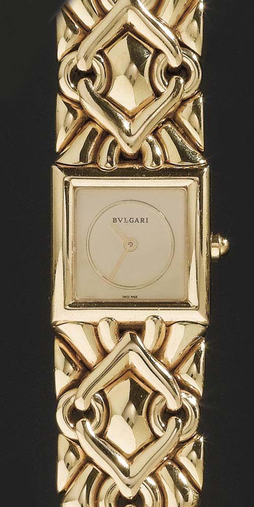 GOLD LADY'S WRISTWATCH, BULGARI, circa 2000. Yellow gold 750. Trika model. Integrated case and strap with gold coloured dial and hands. Ref. BJ06 P.226, Quartz movement. L ca. 17 cm. With case, guarantee and insurance estimate from April 2001