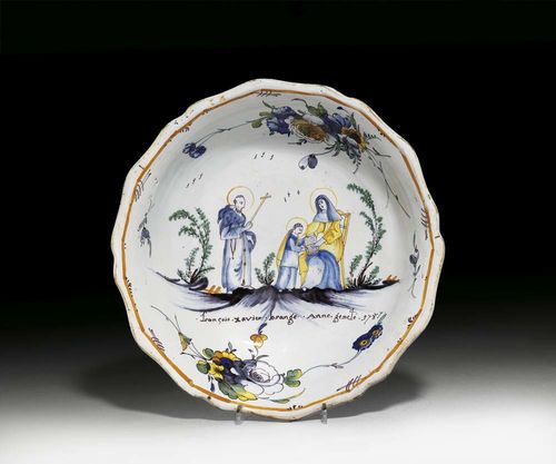 LARGE BOWL, Nevers, dated 1787. Of the 'faïences potronymiques' type. Painted with a group of saints and name day patrons, and entitled 'françois xavier brange Anne geneté 1787'. D 31cm. Provenance: private collection, South Germany