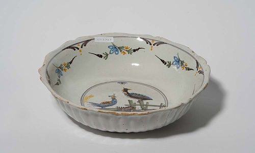 BOWL, Nevers, 2nd half of the 18th century. Painted in blue, green, yellow and manganese with round central medallion with bird. D 28.5cm. The rim somewhat worn. Provenance: private collection, South Germany
