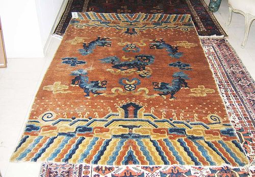 PAIR OF NINGSHIA antique. Brown ground with five dragons in blue and geometric patterning top and bottom. Some wear. 130x214 cm, 132x215 cm.