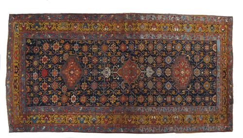 KARABACH antique. Interesting piece with blue ground, finely patterned with three medallions and stylised flowers, triple stepped border in beige and light blue. Good condition.430x210 cm.