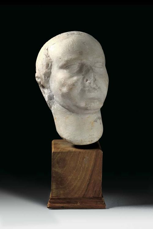 MARBLE HEAD OF VESPASIAN, Roman, 1st century AD. Probably originally with shoulders. Mounted on wooden plinth. H 16 cm. Provenance: Private collection, Zürich.